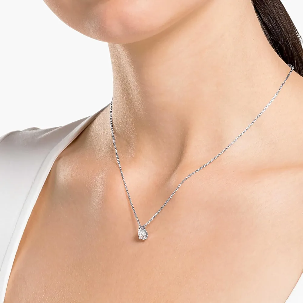 SWAROVSKI CONJUNTO COLLAR Y ARETES GOTA STILLA ATTRACT ACABADO RODIO PARA MUJER | TRANSPARENTE