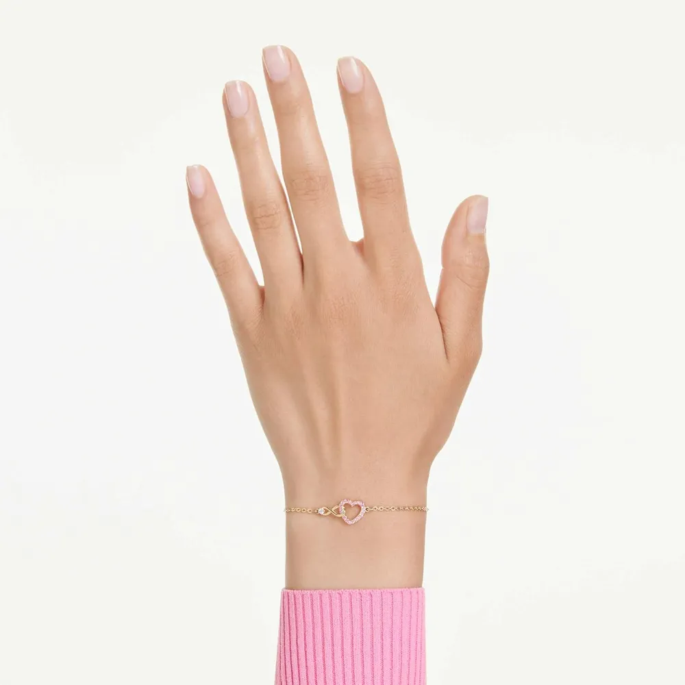 SWAROVSKI PULSERA CORAZÓN INFINITO ACABADO ORO PARA MUJER | DORADO