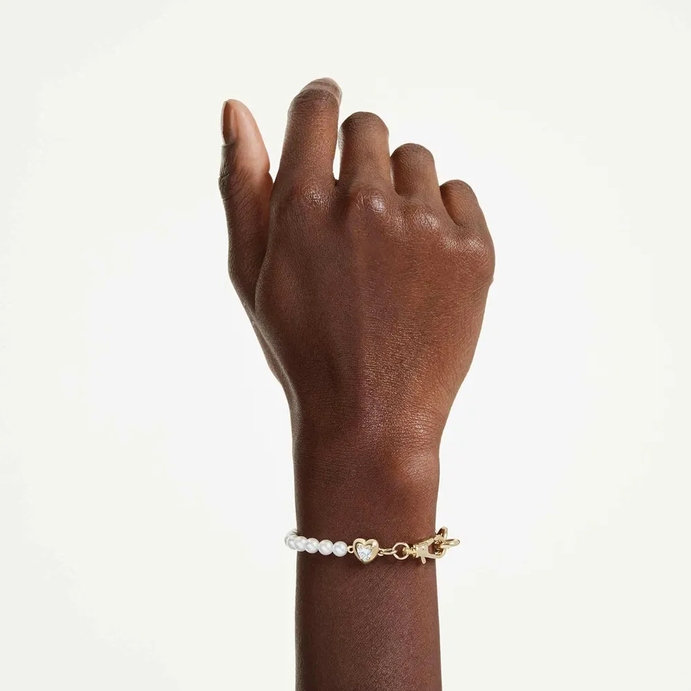SWAROVSKI PULSERA CORAZÓN PERLA ACABADO ORO PARA MUJER | DORADO/BLANCO