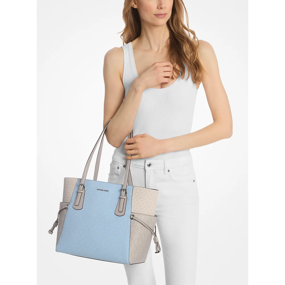 mk785370634_2_webp.webp Michael Kors' Bolso tote Voyager con logo de la firma | Lt Sky Mlt