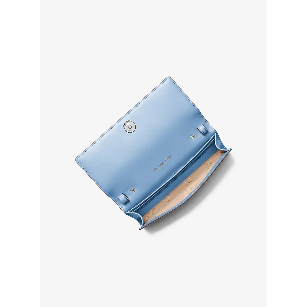 mk785370652_1_webp.webp Michael Kors Bolso bandolera piel granulada Carson | Cielo claro