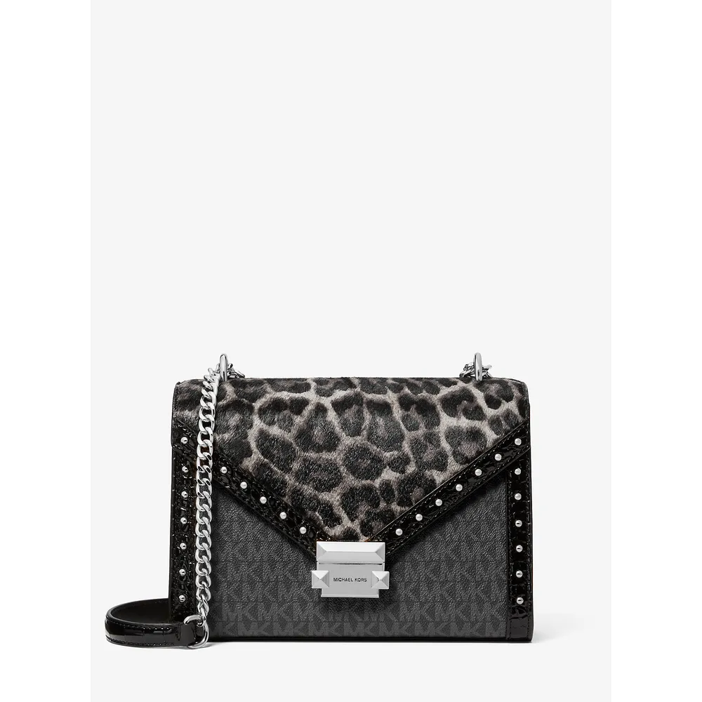 mk785381284_0_webp.webp Michael Kors Bolso Whitney de pelo de becerro con estampado de leopardo | Negro