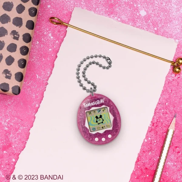TAMAGOTCHI ORIGINAL PURPURINA ROSA LOGO ACTUALIZADO